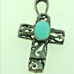 Sterling silver cross with turquoise colored stone
